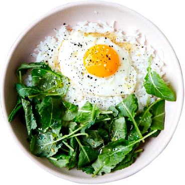 Rice, Fried Egg and Greens on a Bowl